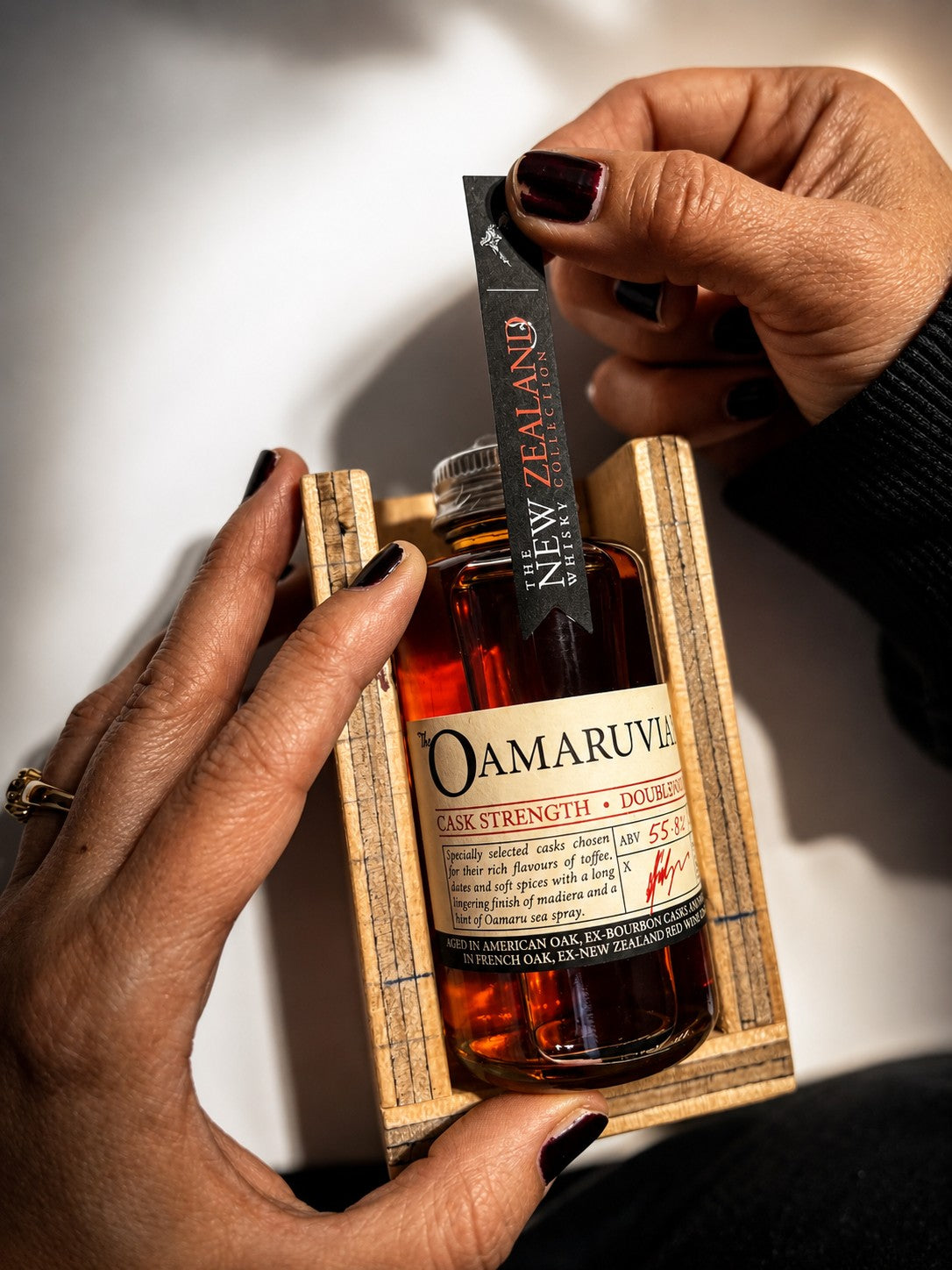 Hand bottling and labelling whisky at the Oamaru bond store